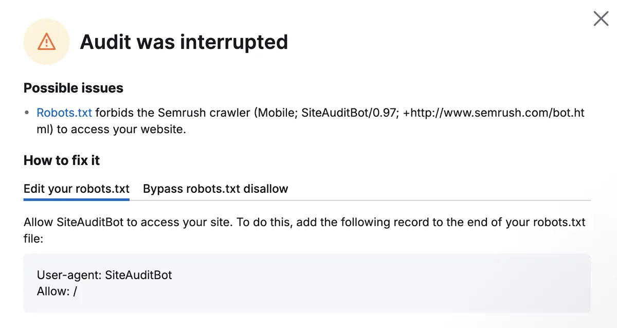 警告显示审计被中断，因为 robots.txt 文件禁止爬虫抓取。