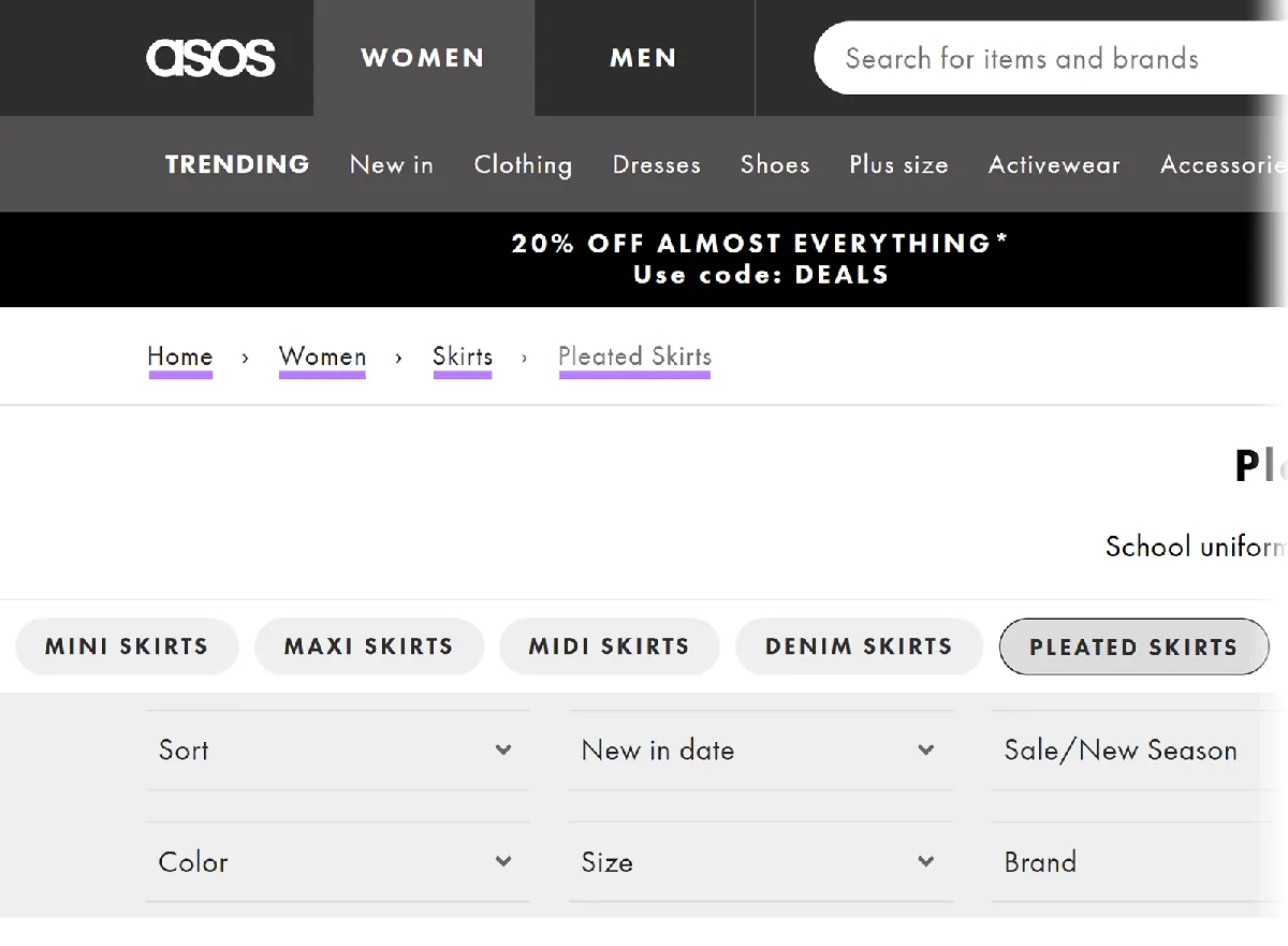 ASOS 网站显示面包屑路径 首页 > 女装 > 裙装 > 百褶裙，每项均带下划线。